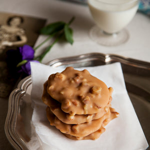 Plate of creamy style pecan pralines. Creamy pralines are softer and chewier.